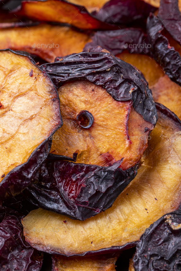 background of sun dried plum slices side view Stock Photo by stoockking
